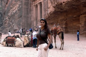 Beautiful traveling woman in the ruins of Petra by Omnimundi