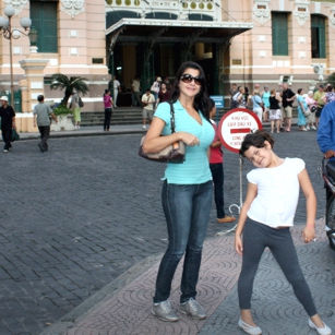 Mother and daughter (tourists) in Ho Chi Minh in front of the Post Office