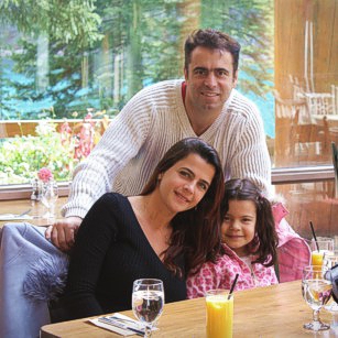 Omnimundi family having breakfast inside a luxury lake border hotel in Canada