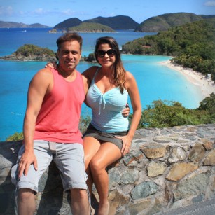Elegand tourists standing in Trunk Bay in US Virgin Islands