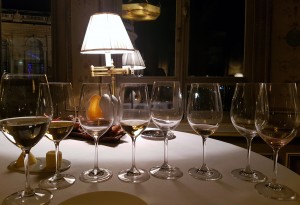 Eight wine glasses inside a luxury restaurant in Paris