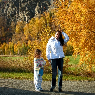 Norway during the falls, by omnimundi showing a woman, a girl and a yellow tree