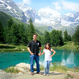 A typical Swiss landscape with a lake and the Matterhorn in the back ground featuring the Omnimundi Family
