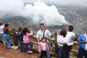 Father and daughter visiting a volcano crater in Costa Rica during a travel to Central Americast