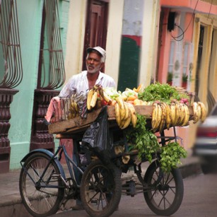 A man selling tropical fruits in the streets of Santo Domingo in Dominican Republic