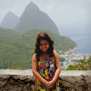 Young tourist posing in the city of Soufriere near the famous Pitons in Saint Lucia