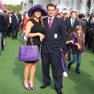 Well dressed Omnimundi Couple attending a luxury party in Longchamps race course in Paris